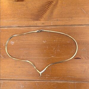 Gold tone necklace with crystal decoration